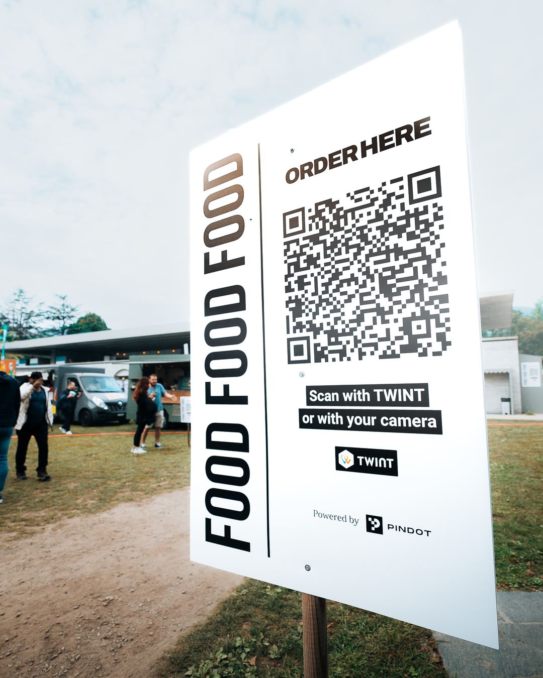 A self-ordering sign at an event: scan the QR code with TWINT or with the camera.